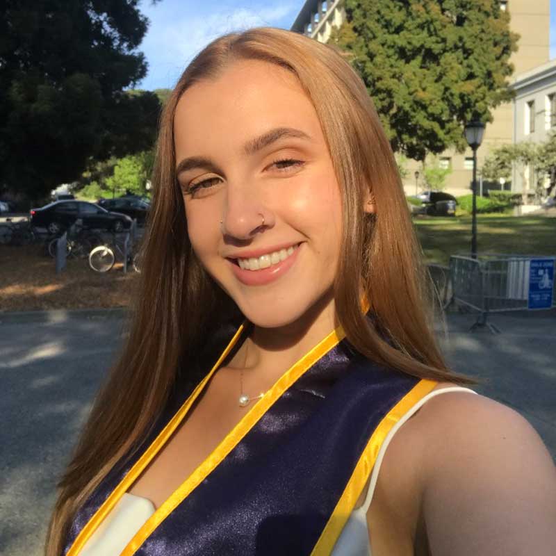 Katrina Rodriguez smiling in Berkeley after graduation